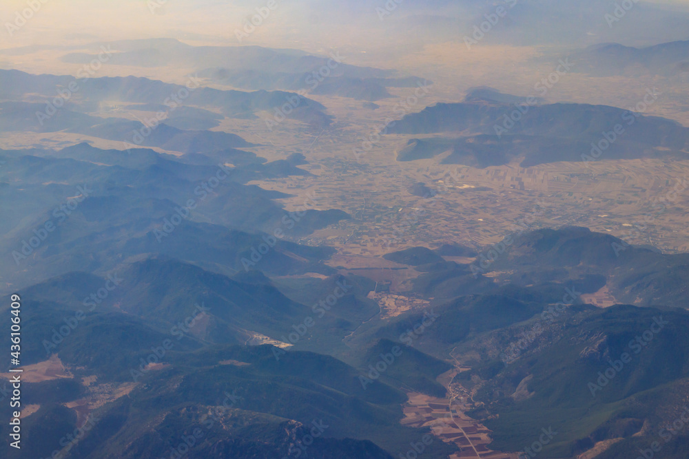 View of the Taurus mountains in Antalya province, Turkey. View from airplane View of the Taurus mountains in Antalya province, Turkey. View from airplane