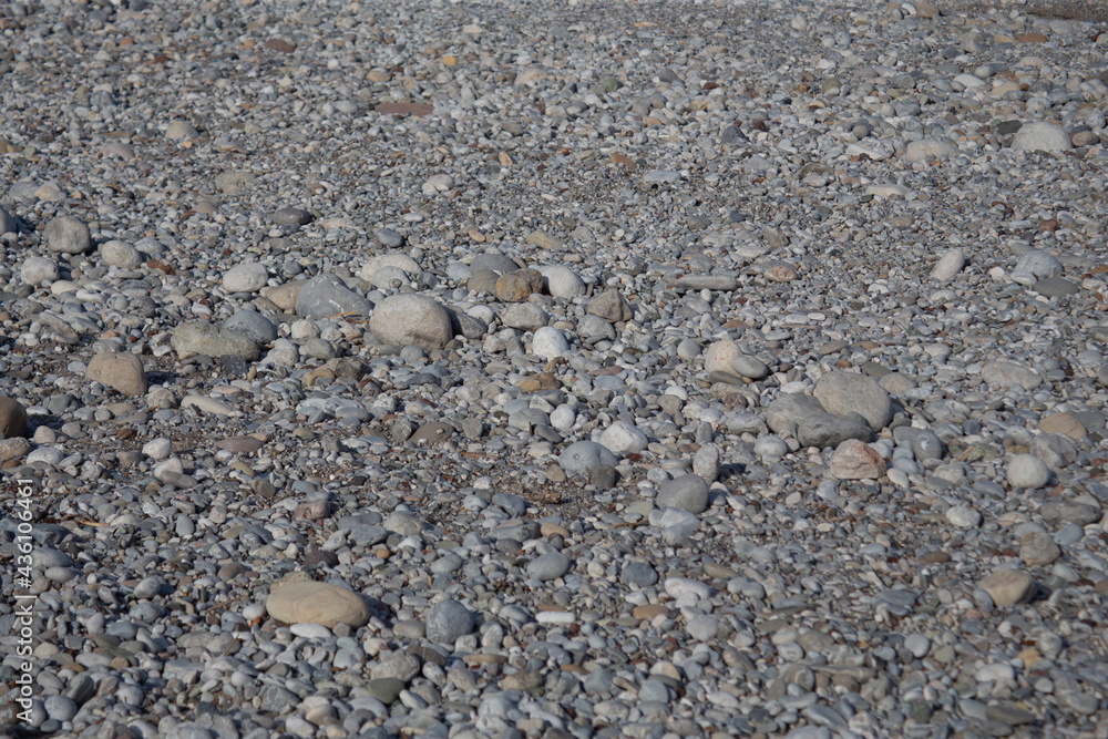Background of stones on the beach near the sea Background of stones on the beach near the sea