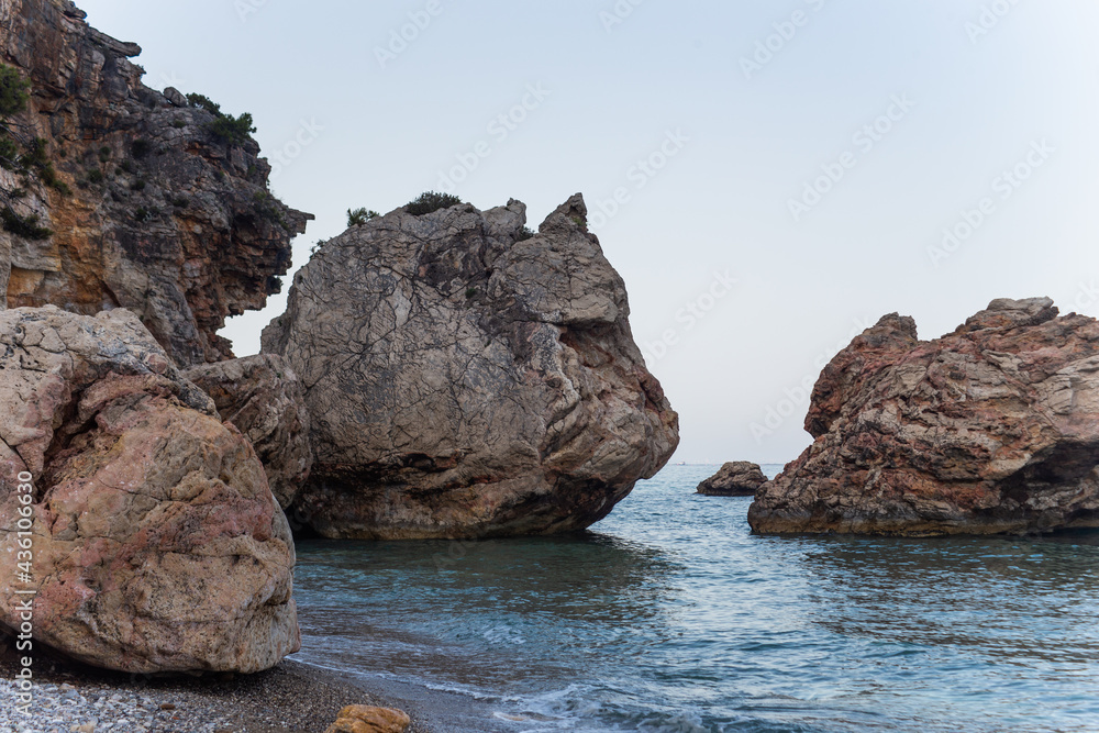 Large boulders near the cliff by the sea