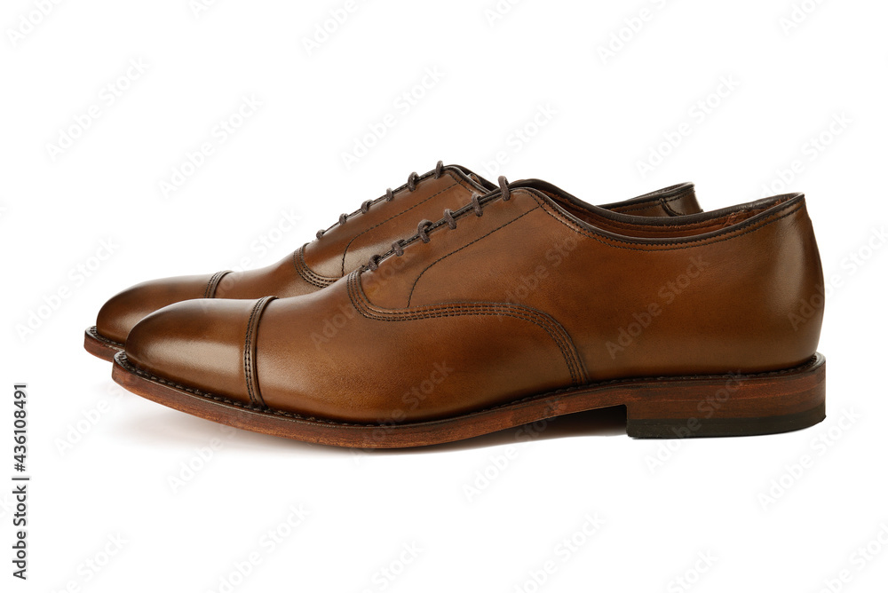 Men's brown oxford fashion shoes isolated on a white background. Men's brown oxford fashion shoes isolated on a white background.