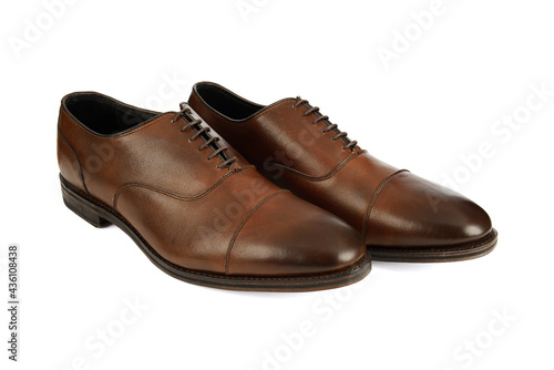 Men's brown oxford fashion shoes isolated on a white background.