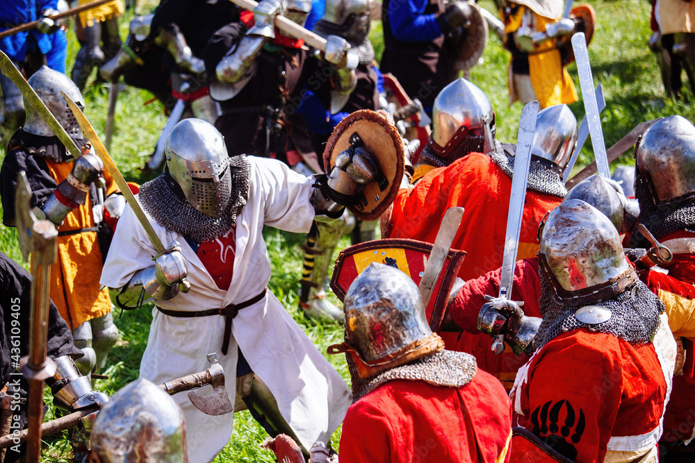 Battle of medieval knights on the battlefield, historical reconstruction