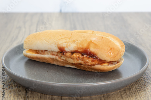 Appetizing BBQ chicken sandwich is a perfect meal for a quick lunch break at work.