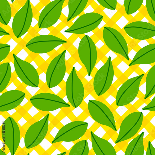 Leaves pattern seamless in bright colors. Repeat yellow plaid background with fruit vector pattern. Citrus fruit drawing. Great as wallpaper, fabric pattern or textile design.