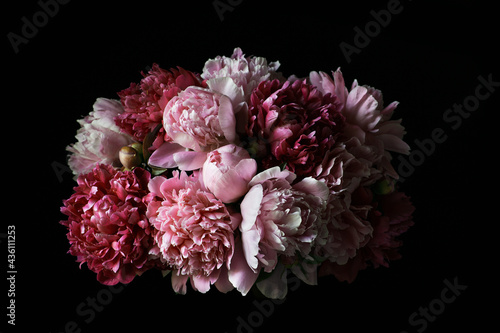 Bouquet of red and pink peonies on a black background. Vintage postcard. Template for business cards  congratulations  invitations  interior decoration and more.