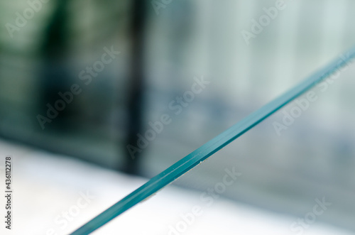 Detail of the glass used for the parapet, double transparent and clean glass, the double shockproof glass protects against falling. Used in modern buildings with contemporary architecture. photo