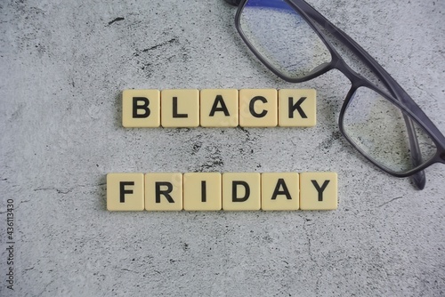 Black Friday is a colloquial term for the Friday following Thanksgiving in the United States, block on ceramic background.