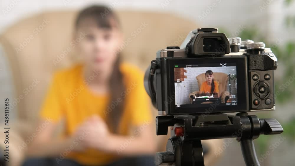 Child gives advice on video. A young busy child makes her vog and speak on video in the room. Child gives advice on video. A young busy child makes her vog and speak on video in the room.