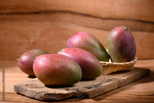 Fresh palmer mango on wooden background, Tropical fruit photo