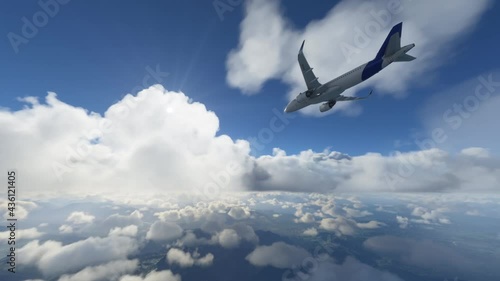 Commercial plane flying through clouds over terrain with the sun shining in the sky. Cargo airplane having air turbulence