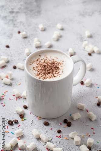 Foamy and creamy raf coffee with cocoa powder on top, above view for a menu photo