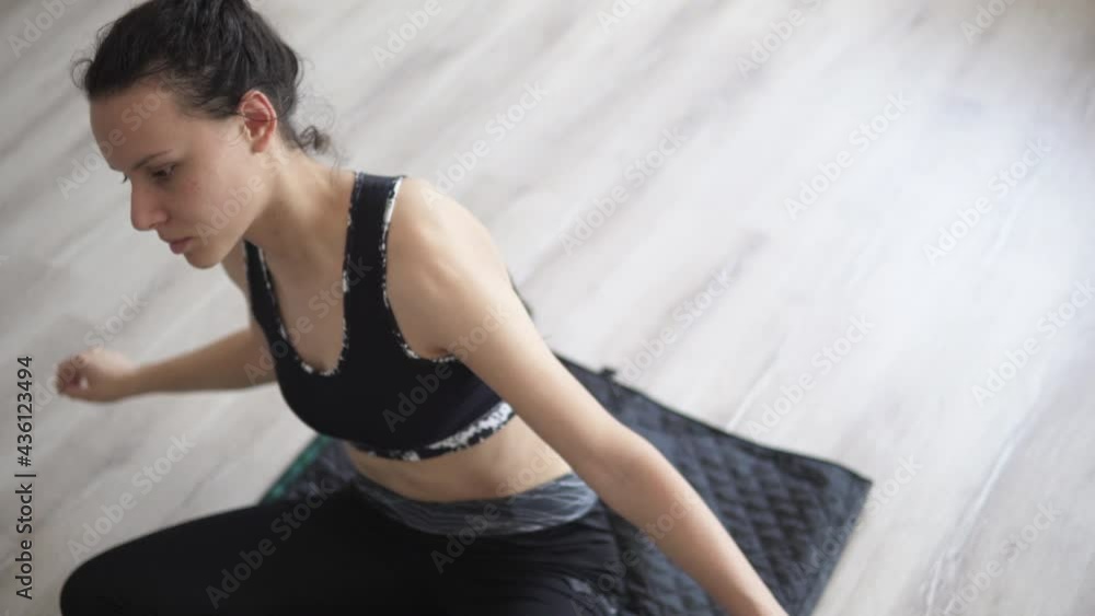 Woman doing physical exercise and stretching spine on a mat, exercise, yoga and relaxation concept Woman doing physical exercise and stretching spine on a mat, exercise, yoga and relaxation concept
