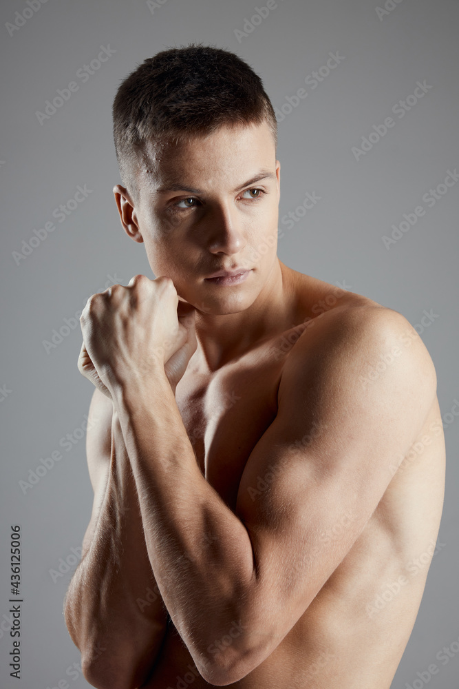 Fototapeta premium attractive man with bulging arm muscles boxer bodybuilder fitness