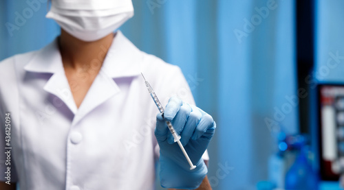 Nurse present Covid-19 Vaccine in insulin Syringe for a Dose