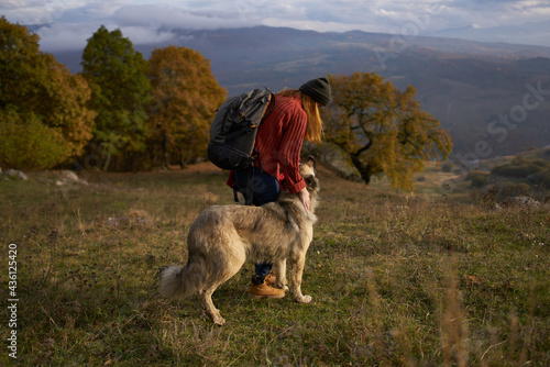 woman tourist next to dog and walk friendship journey © SHOTPRIME STUDIO