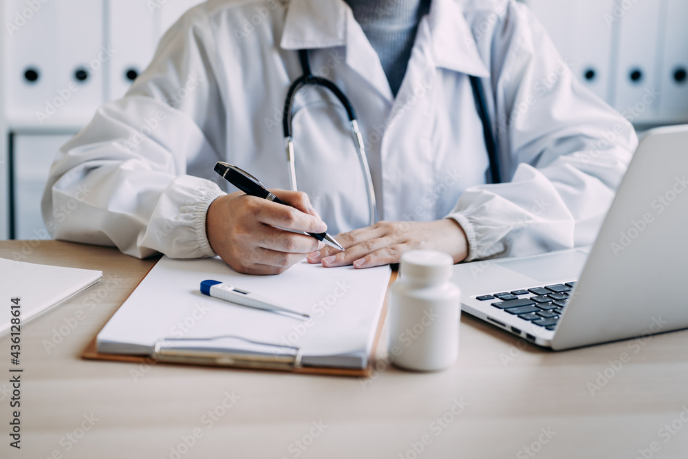 female doctor talking with a patient via video call online on a laptop computer. remote support videoconferencing medicine, medical help for distance patient, telehealth, telemedicine concept. female doctor talking with a patient via video call online on a laptop computer. remote support videoconferencing medicine, medical help for distance patient, telehealth, telemedicine concept.