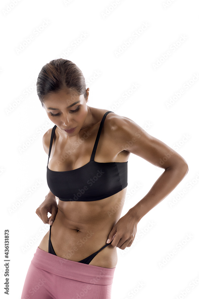 Fit Young Woman In Sportswear Looking Down Fit Young Woman In Sportswear Looking Down