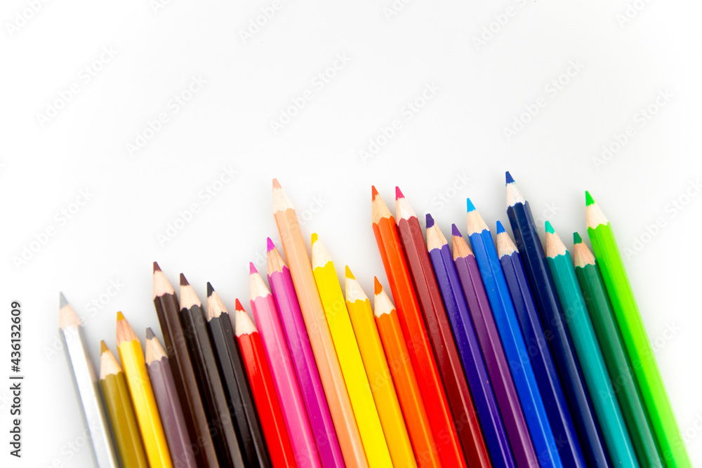 Coloured Pencils on White Paper Background Coloured Pencils on White Paper Background