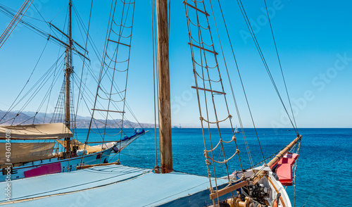 Pleasure yachts and sailboats anchored near stone pier in marina of the Red S...