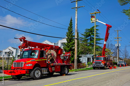 The repair team works on the power transmission line poles and carries out routine repairs and maintenance. Vehicle specially equipped with a lift for repair work on power line