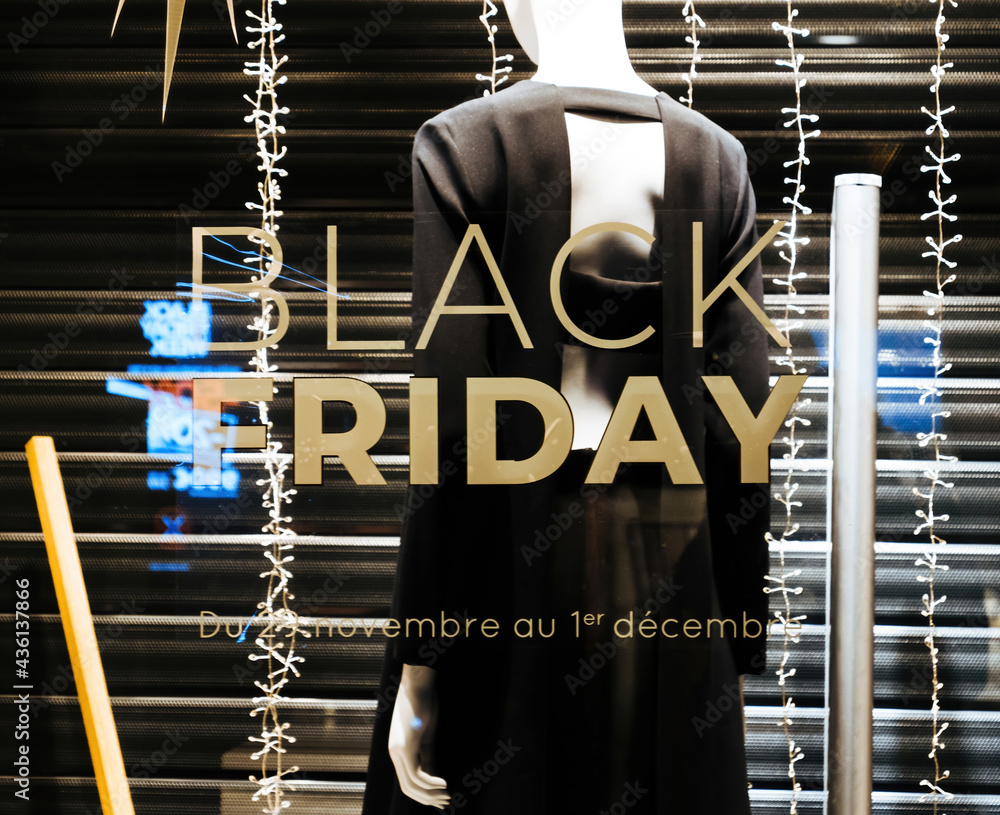 Black Friday signage on the showcase of the fashion retailer with rear