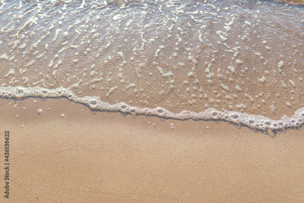 Soft wave of the sea on the sandy beach.Soft focus,blurred image. Soft wave of the sea on the sandy beach.Soft focus,blurred image.