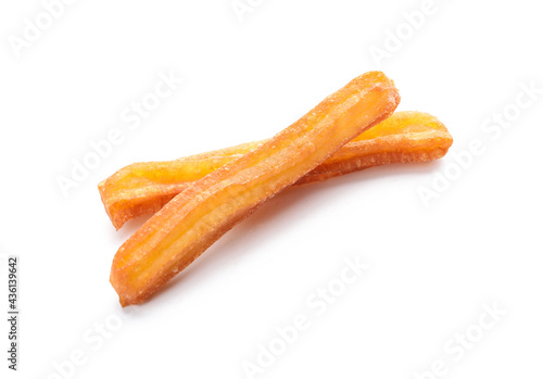 Tasty churros on white background