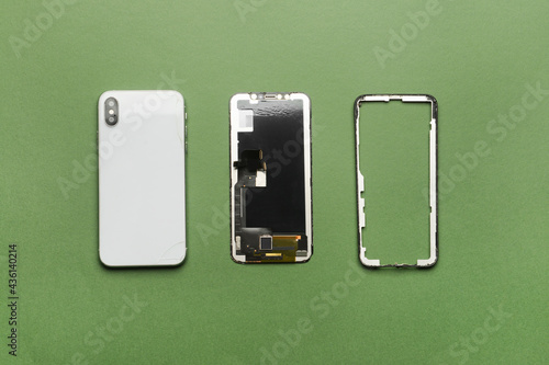 Canvas Print Disassembled mobile phone on color background