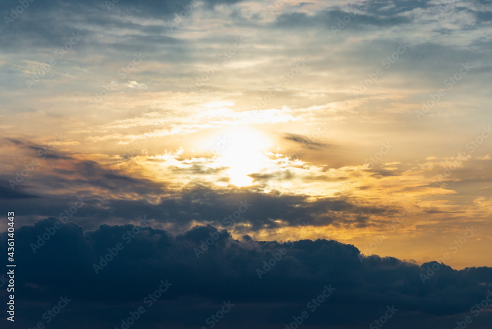 Dramatic sunset sky with clouds.Sunset or sunrise with clouds, light rays and atmospheric effect