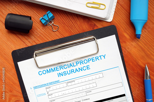 Business concept about COMMERCIALPROPERTY INSURANCE with phrase on the business paper photo