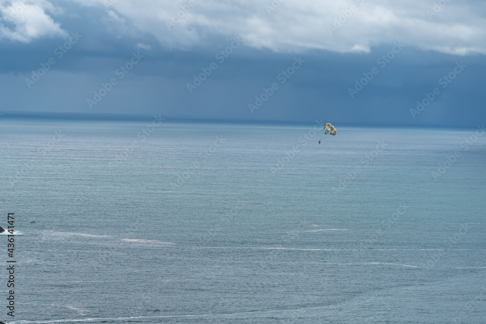 Beautiful aerial view of Paragliding in the beach of Manuel Antonio Quepos in Costa Rica