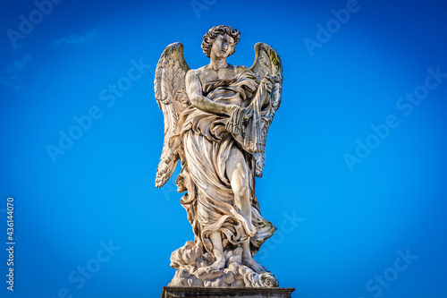 Medieval outdoor stone statue of an Angel with whips by Lazzaro Morelli on Sant Angelo Bridge in Rome  Lazio region  Italy