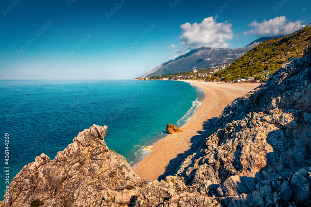 Aerial spring view of publik beach in Dhermi town. Amazing morning seascape of Adriatic sea. Colorful spring scene of Albania, Europe. Traveling concept background..