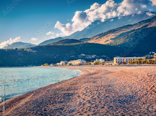 Sunny spring view of empty Livadhi beach, Himare location. Picturesque morning scene of Albania, Europe. Calm seascape of Adriatic sea. Beauty of nature concept background. photo