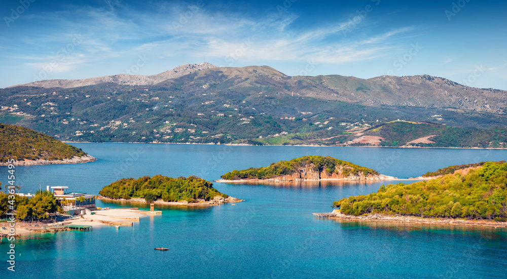 Aerial seascape of Ionian sea with Corfu island on background. Colorful spring view of Ksamil village. Splendid outdoor scene of Albania, Europe. Traveling concept background..