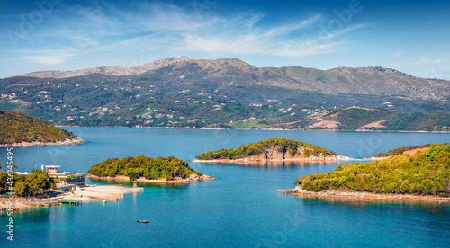Aerial seascape of Ionian sea with Corfu island on background. Colorful spring view of Ksamil village. Splendid outdoor scene of Albania, Europe. Traveling concept background..