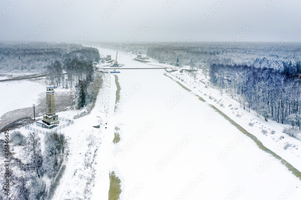 A view from a height on a winter day at Big Volzhsky lighthouse on the river. Dubna city, Moscow region, Russia.
