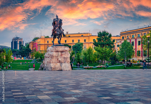 Splendid spring view of monument of Skanderbeg in Scanderbeg Square. Picturesque sunset in capital of Albania - Tirana. Traveling concept background..