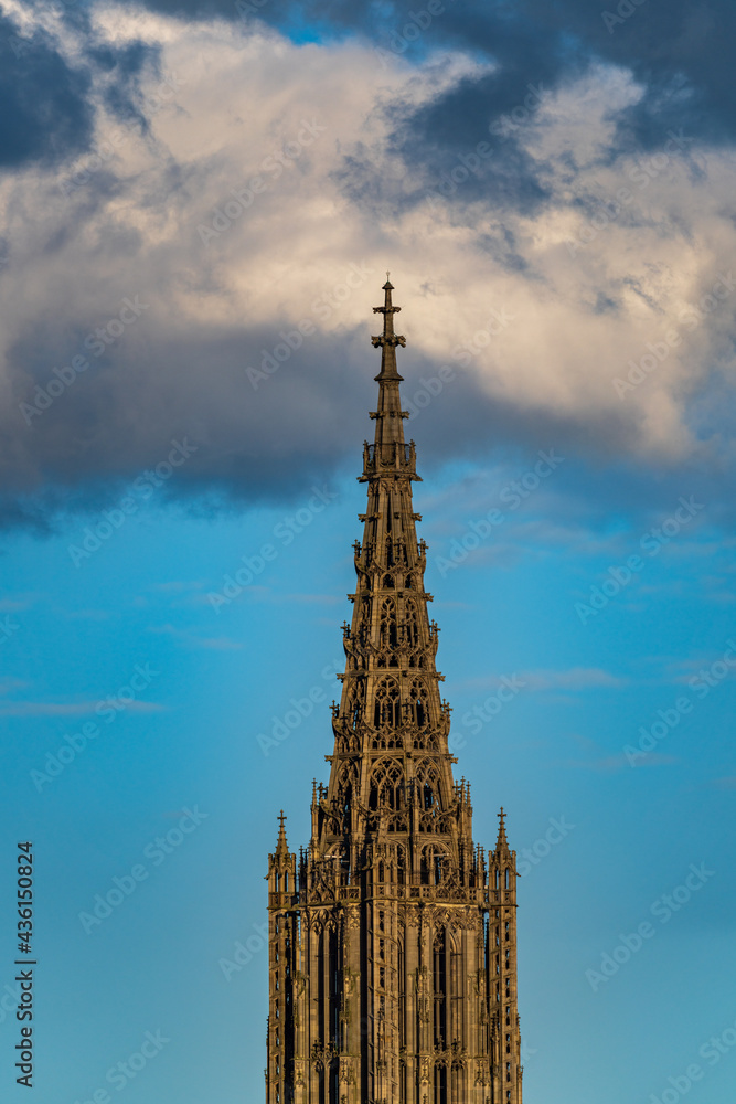 Top of ulm Minster at sunset with clear blue blackground Top of ulm Minster at sunset with clear blue blackground