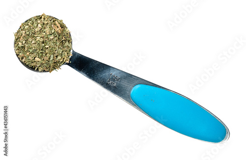 crushed parsley herb in measuring teaspoon cutout photo