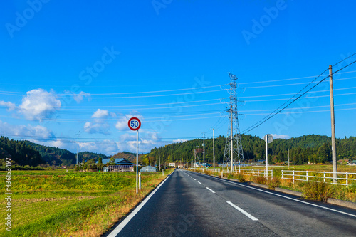 Autumn forest scenery with rural road in Miyagi prefecture, Tohoku, Japan. photo