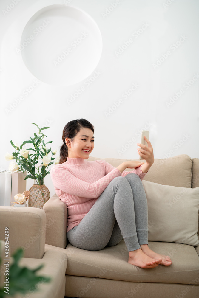 Video call conference, Happy girl having a video chat on mobile phone at home Video call conference, Happy girl having a video chat on mobile phone at home