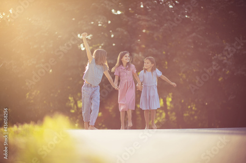 Three little girls spending time outside.