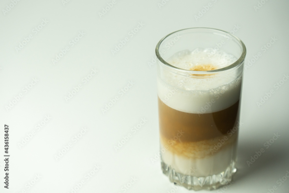 Glass of latte coffee on light background Glass of latte coffee on light background