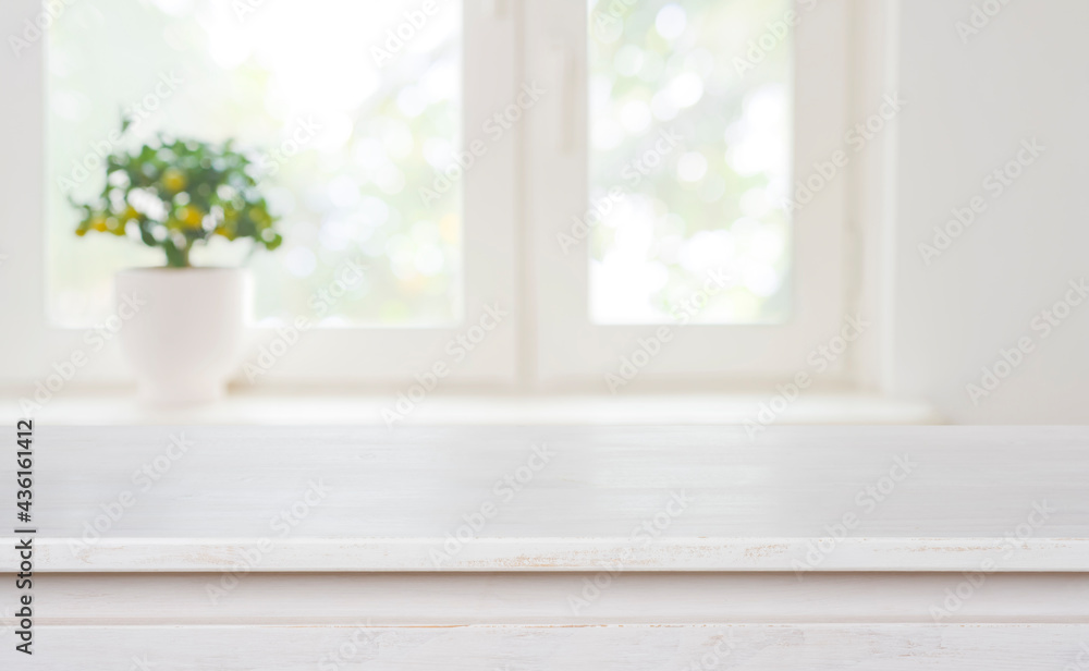 Bleached wooden table on blurred window background with copy space Bleached wooden table on blurred window background with copy space