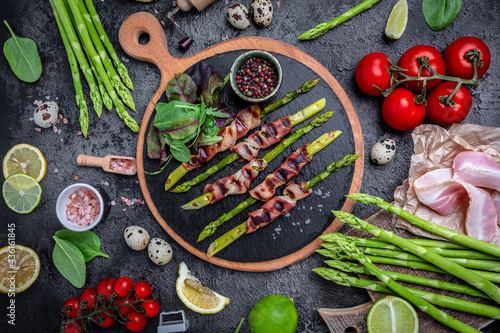 Grilled green asparagus wrapped with bacon. Keto diet. banner, menu recipe place for text, top view