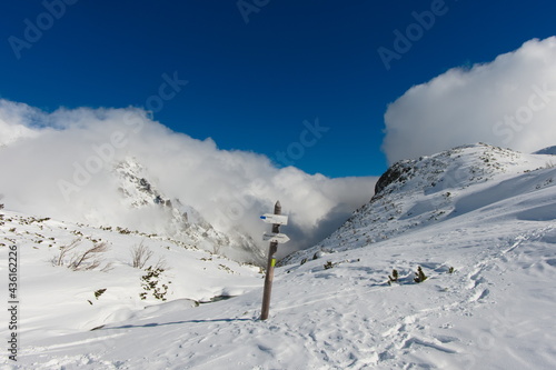 Mountain signpost in winter scenery. Winter in the Tatra Mountains, Poland. © Tomek