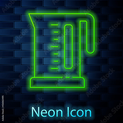 Glowing neon line Electric kettle icon isolated on brick wall background. Teapot icon. Vector