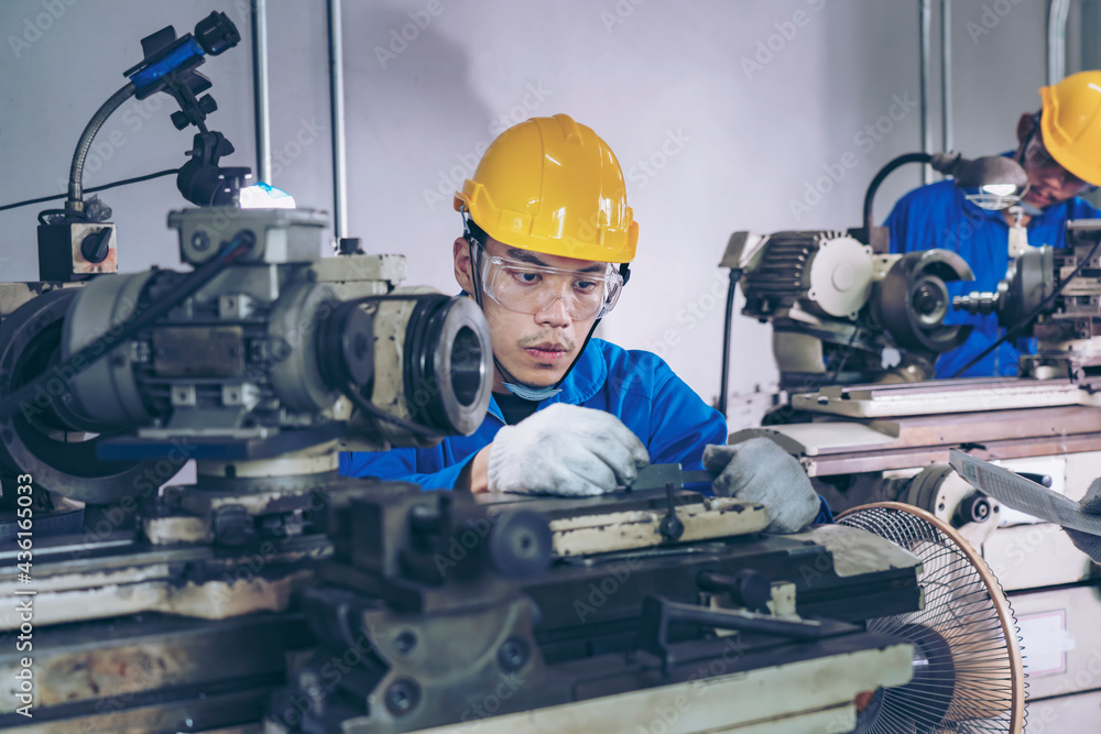 Finishing metal working on high precision CNC grinding machine in workshop. Finishing metal working on high precision CNC grinding machine in workshop.