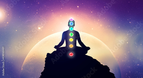 Obraz na plátně Meditating men in yoga lotus position with chakras